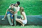 Boy with parents, sitting on father's lap