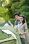 Young campers setting up tent