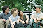 Group of young hikers in back of pick-up truck