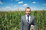 Businessman by Cornfield