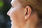 Close-up Of Woman's Ear with Hearing Aid
