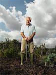 Portrait of Mature Man Standing in Garden