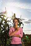 Portrait of Woman in Front of Corn Plants