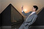 Businessman holding mobile phone