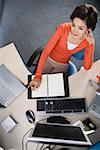 Young woman sitting at desk in office