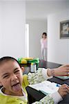 Boy sticking out tongue, close-up