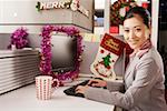 Portrait of a businesswoman sitting by computer, smiling