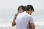 Young couple embracing at beach