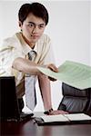 Young businessman holding file