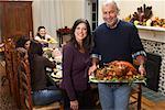 Couple with Thanksgiving Turkey