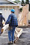 Construction Workers Building Addition on Home