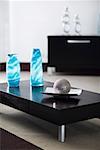 Ball with a tray and two decorative glass vases on a table