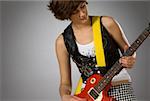 Close-up of a female guitarist playing a guitar