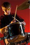 Male drummer playing drums