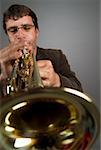 Close-up of a male musician playing a trumpet