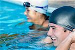 Close-up of a young couple smiling in a swimming pool