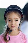 Portrait of a girl wearing a riding hat