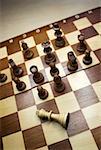 High angle view of chess game with a fallen king