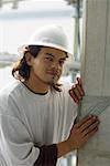 Portrait of a male construction worker using a set square