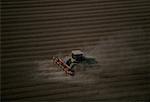 Plowing farm field, aerial