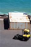 High angle view of a forklift and cargo containers at a commercial dock