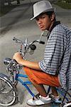 Portrait of a teenage boy cycling on a low rider bicycle