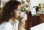 Close-up of a mature woman drinking a cup of tea