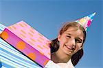 Portrait of a girl smiling with birthday presents