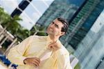 Businessman adjusting his tie