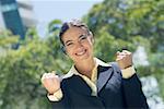Portrait of a businesswoman clenching her fist