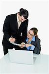 Businessman and a businesswoman working in an office