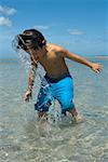 Boy playing on the beach