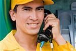 Portrait of a mid adult man talking on the telephone and smiling