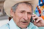 Close-up of a senior man talking on a mobile phone