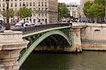 Arch bridge over a river, Paris, France