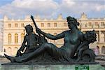 Statue in front of a palace, Palace of Versailles, Versailles, France