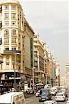 Traffic on a road in front of a hotel, TRYP Gran Via Hotel, Gran Via, Madrid, Spain