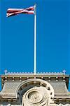 Low angle view of a US State Flag on a government building, State Capitol Building, Iolani Palace, Honolulu, Oahu, Hawaii Islands,