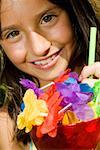 Portrait of a girl holding a glass of mocktail