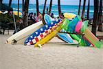 Surfboards and pool rafts on the beach, Waikiki Beach, Honolulu, Oahu, Hawaii Islands, USA