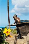 Statue of a man lying on front on the surfboard, Waikiki Beach, Honolulu, Oahu, Hawaii Islands, USA