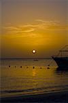 Yacht in the sea at sunset, West Bay Beach, Roatan, Bay Islands, Honduras