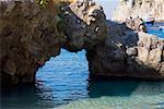 Close-up of a natural arch in a rock formation, Faraglioni Rocks, Capri, Campania, Italy