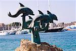 Statues at the seaside, Mandraki Harbor, Rhodes, Dodecanese Islands, Greece