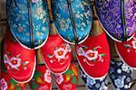 High angle view of embroidery slippers in racks, Beijing, China