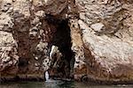 Cave in a cliff, Ballestas Islands, Paracas National Reserve Paracas, Ica Region, Peru