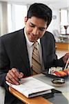 Man with Newspaper and Sushi