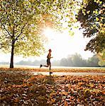 Young man running in park.