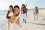 Family Running on the Beach