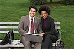 Business People on Park Bench, New York City, New York, USA